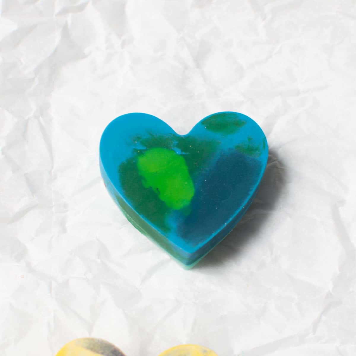 green and blue heart shaped crayon