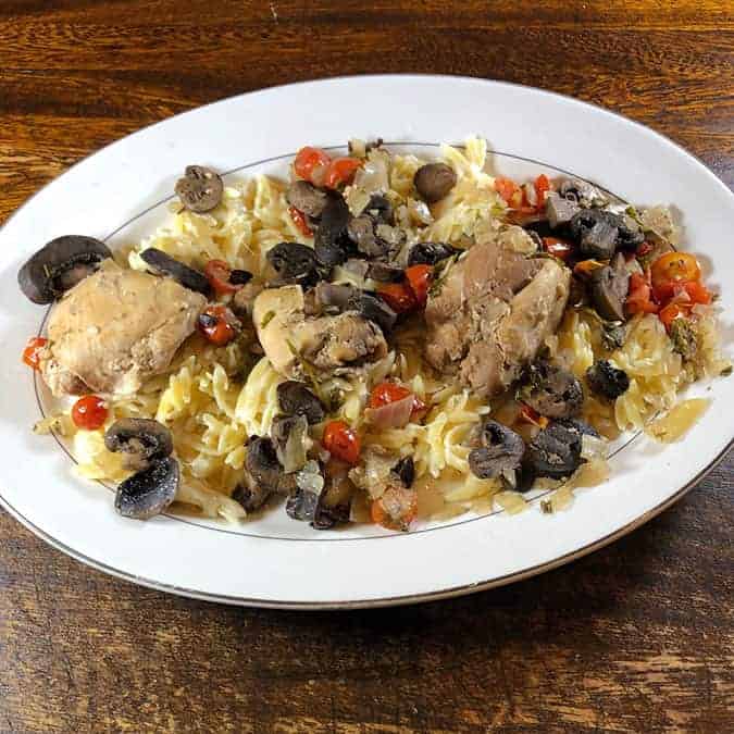 chicken chasseur on a white plate