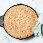Cast Iron Skillet Zucchini Bread on a marble background.