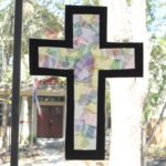 Tissue Paper Cross Craft in a window.