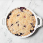 Blueberry Pie Baked Oatmeal in a white pie dish.