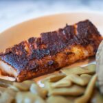 blackened cod next to Italian green beans