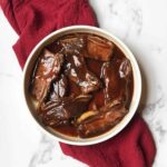 crockpot dr pepper ribs in a white dish
