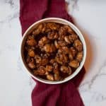 Copycat Golden Corral Bourbon Chicken in a white bowl with a red linen