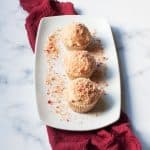 Strawberry Crunch Cupcakes on a white plate with a red linen