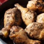 cast iron skillet chicken drumsticks upclose shot