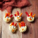 Thanksgiving Deviled Eggs on a wooden tray