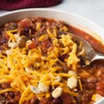 Copycat Wendy's Chili in the Crockpot with cheddar and crackers