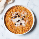 Crockpot Pumpkin Chickpea Curry with coconut flakes and raisins