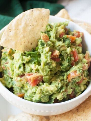 guacamole without onions in a white bowl