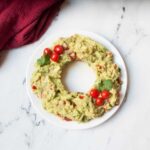Christmas Guacamole on a white plate