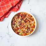 Copycat Panera Turkey Chili with a red linen nearby