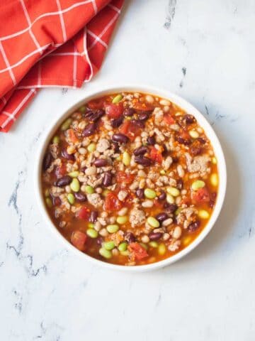 Copycat Panera Turkey Chili with a red linen nearby