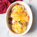 copycat alice springs chicken in a white casserole dish