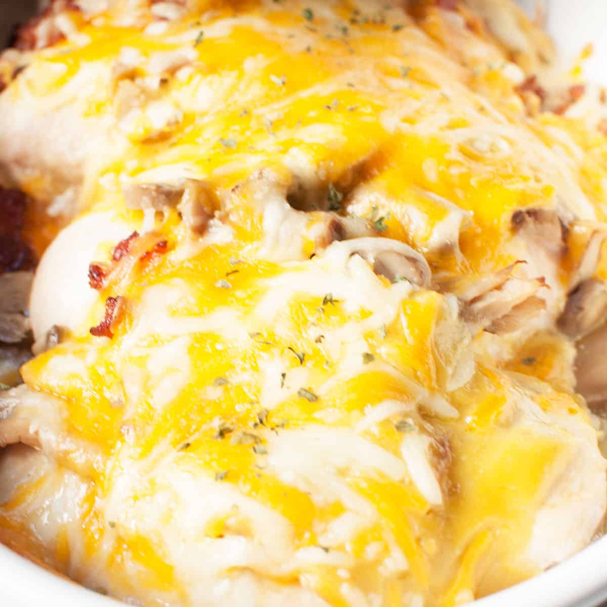 close up view of  Alice Springs Chicken (chicken covered in a cheese sauce)