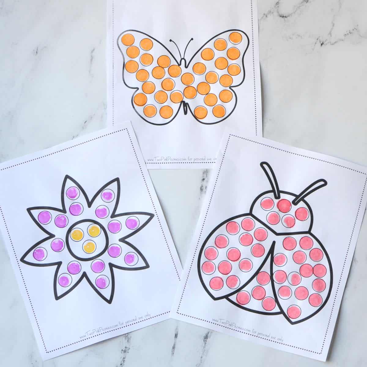 three dot marker pages (Butterfly, flower, and ladybug) that have been dotted in