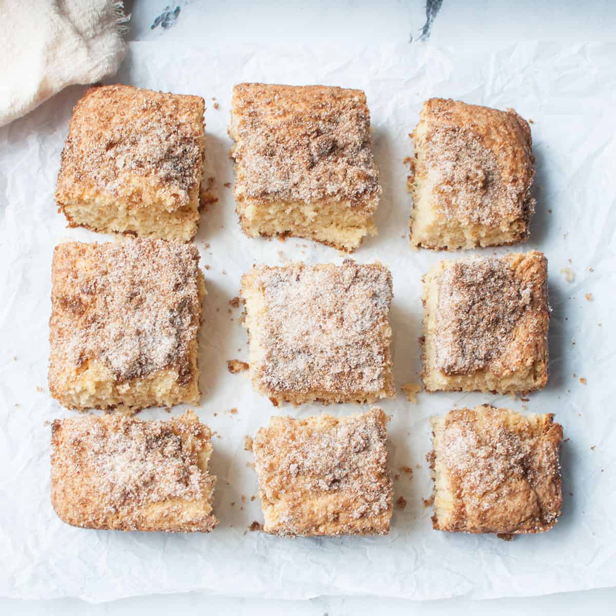 Amish Coffee Cake slices on  parchment paper. 