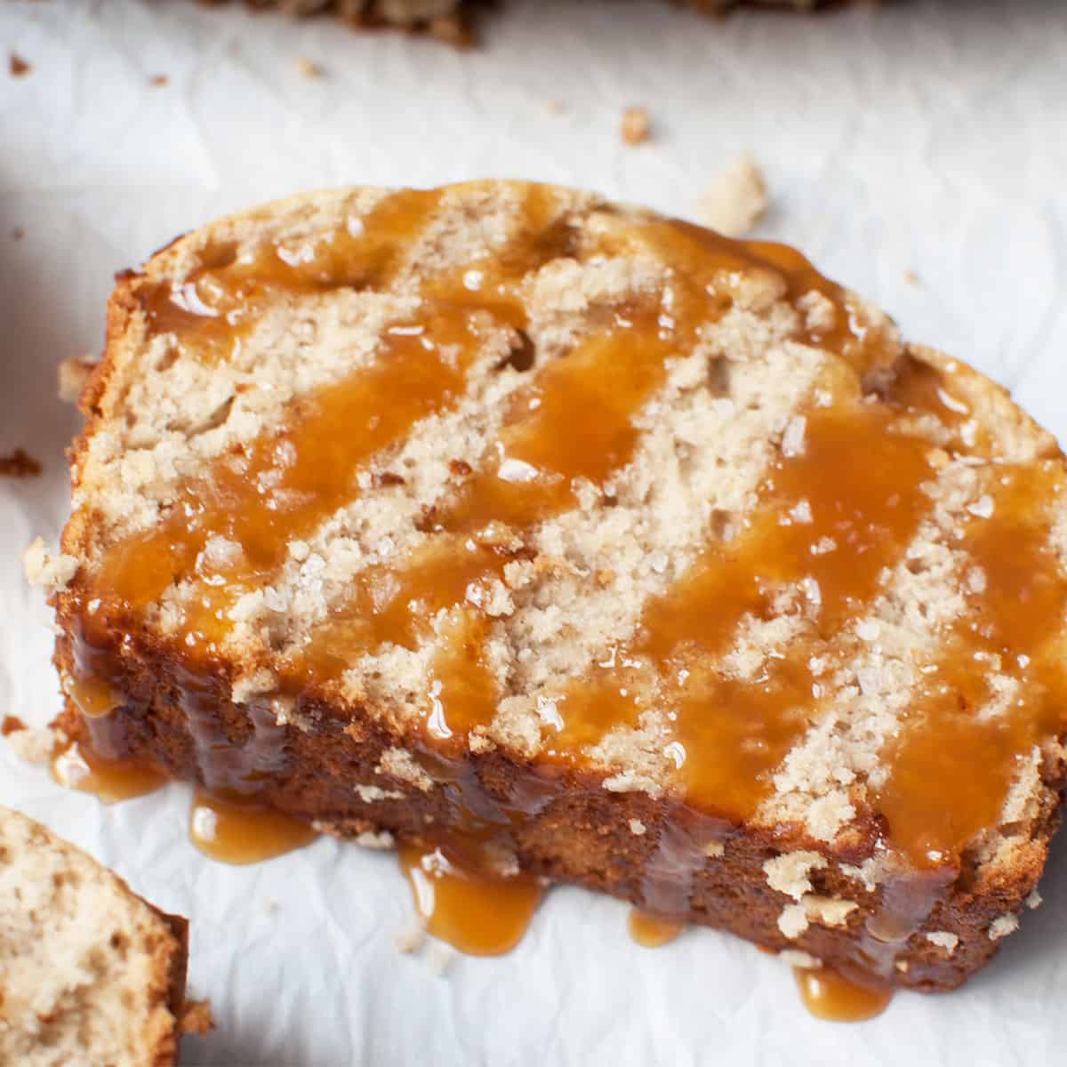 One slice of banana bread covered in caramel and sea salt.