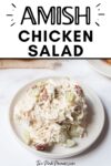 Text that says Amish Chicken Salad below is a plate with chicken salad on it. The chicken salad has grapes and pecans in it.