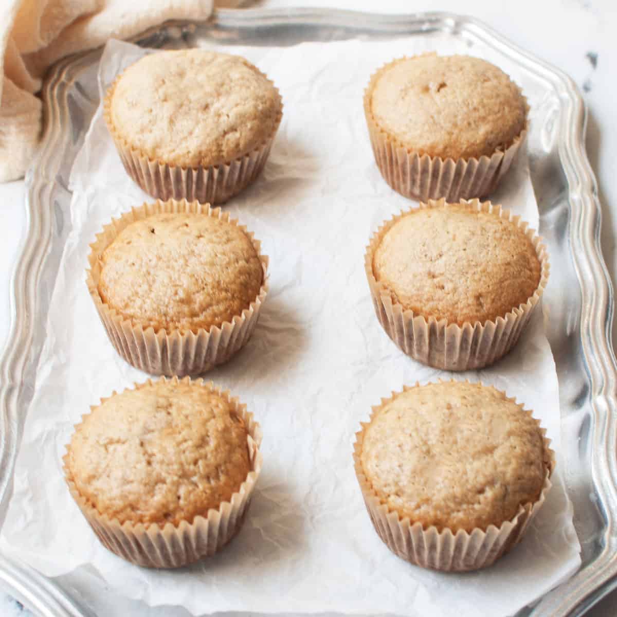 Banana muffins on a silver tray.