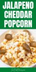 Text that says Jalapeno Cheddar popcorn. Below the text is an image of popcorn with cheddar seasoning and pickled jalapenos in it.