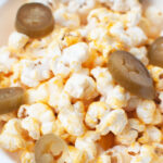 A close up photo of jalapeño cheddar popcorn.