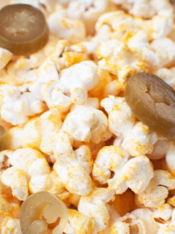 A close up photo of jalapeño cheddar popcorn.
