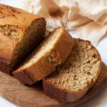 Fannie Farmer's Banana Bread on a wooden tray.