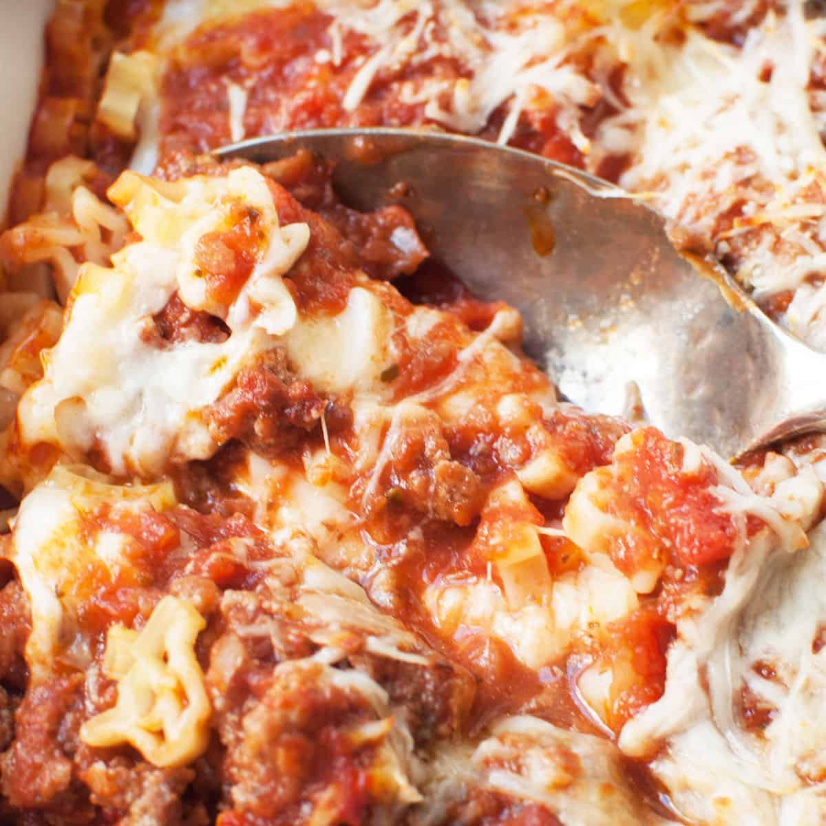 A spoon scooping Texas baked pasta.