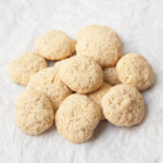 A pile of Sourdough Vanilla Wafers on a white background.