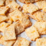 Sourdough cheese it crackers on a white background.