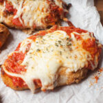 A close up photo of sourdough discard chicken parmesan.