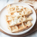 Sourdough Protein Waffles with butter on top of them.