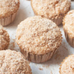 Sourdough Apple Cider Muffins on a white background.