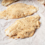 Copycat Golden Corral Baked Fish on white parchment paper.