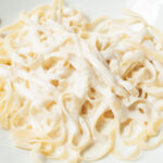 A bowl of fettuccine and Copycat Buca Di Beppo Alfredo