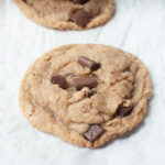 A close up photo of a copycat Starbucks chocolate chip cookie on a white background.