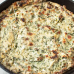 Copycat Cheesecake Factory Spinach Dip in a cast iron skillet.