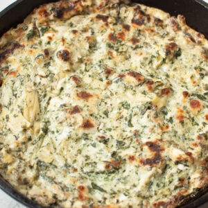 Copycat Cheesecake Factory Spinach Dip in a cast iron skillet.