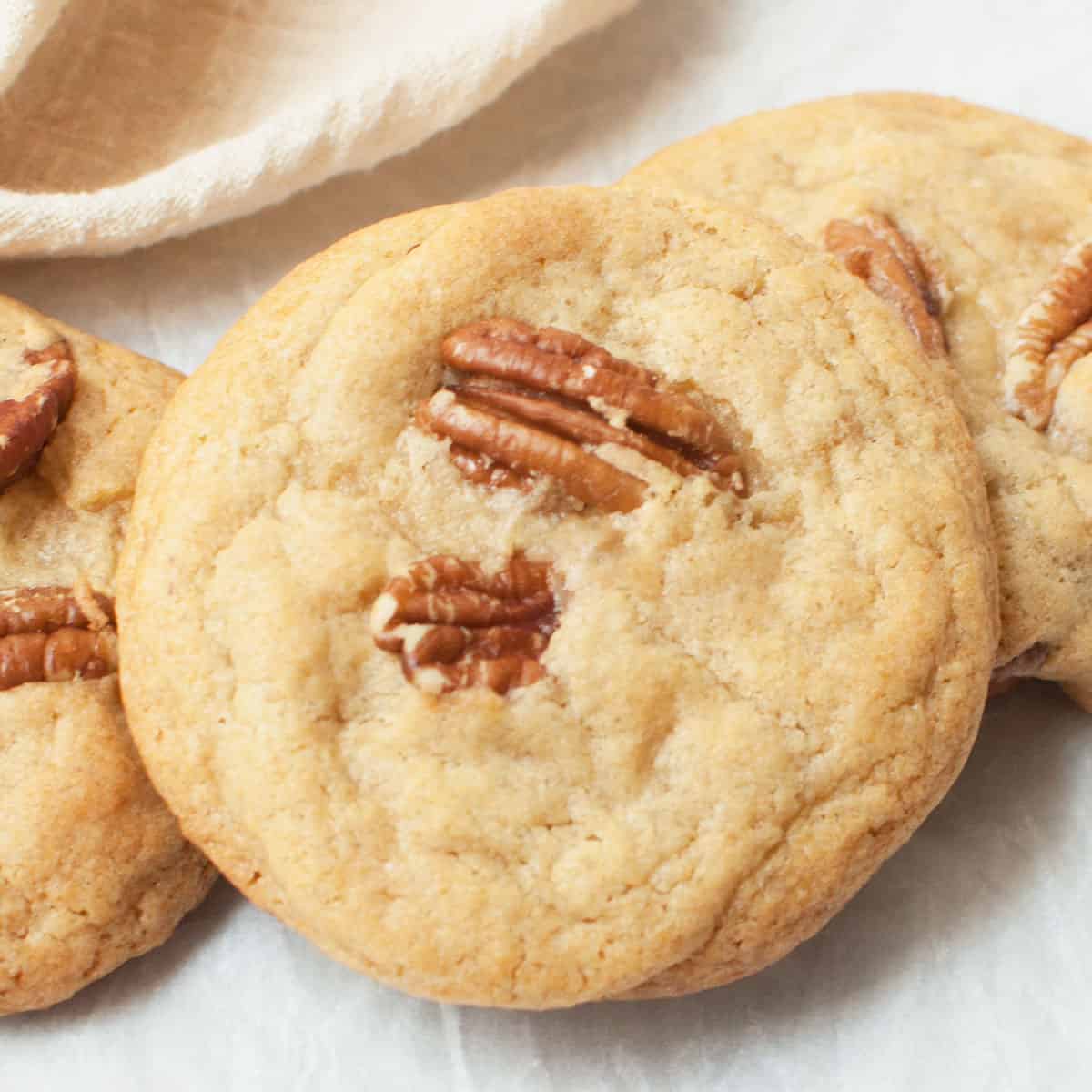 Old fashioned pecan cookies on a white background.