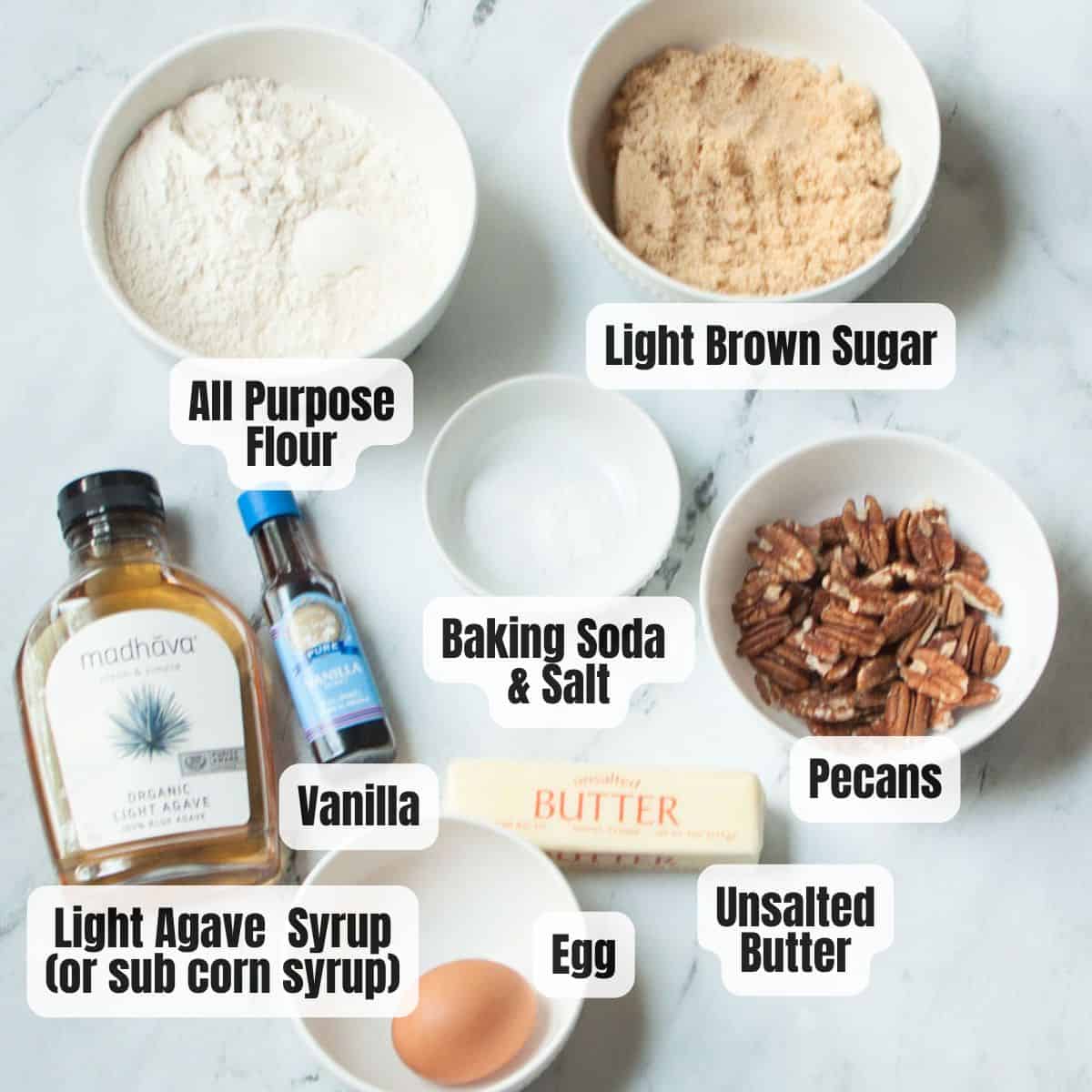 The ingredients needed to make old fashioned pecan cookies.