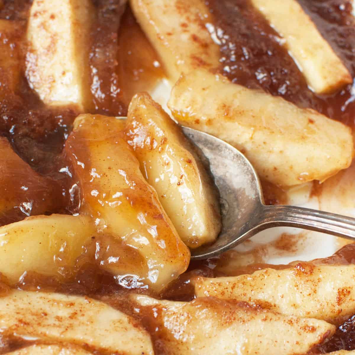 An up close photo of a spoon scooping copycat Boston Market Cinnamon Apples.
