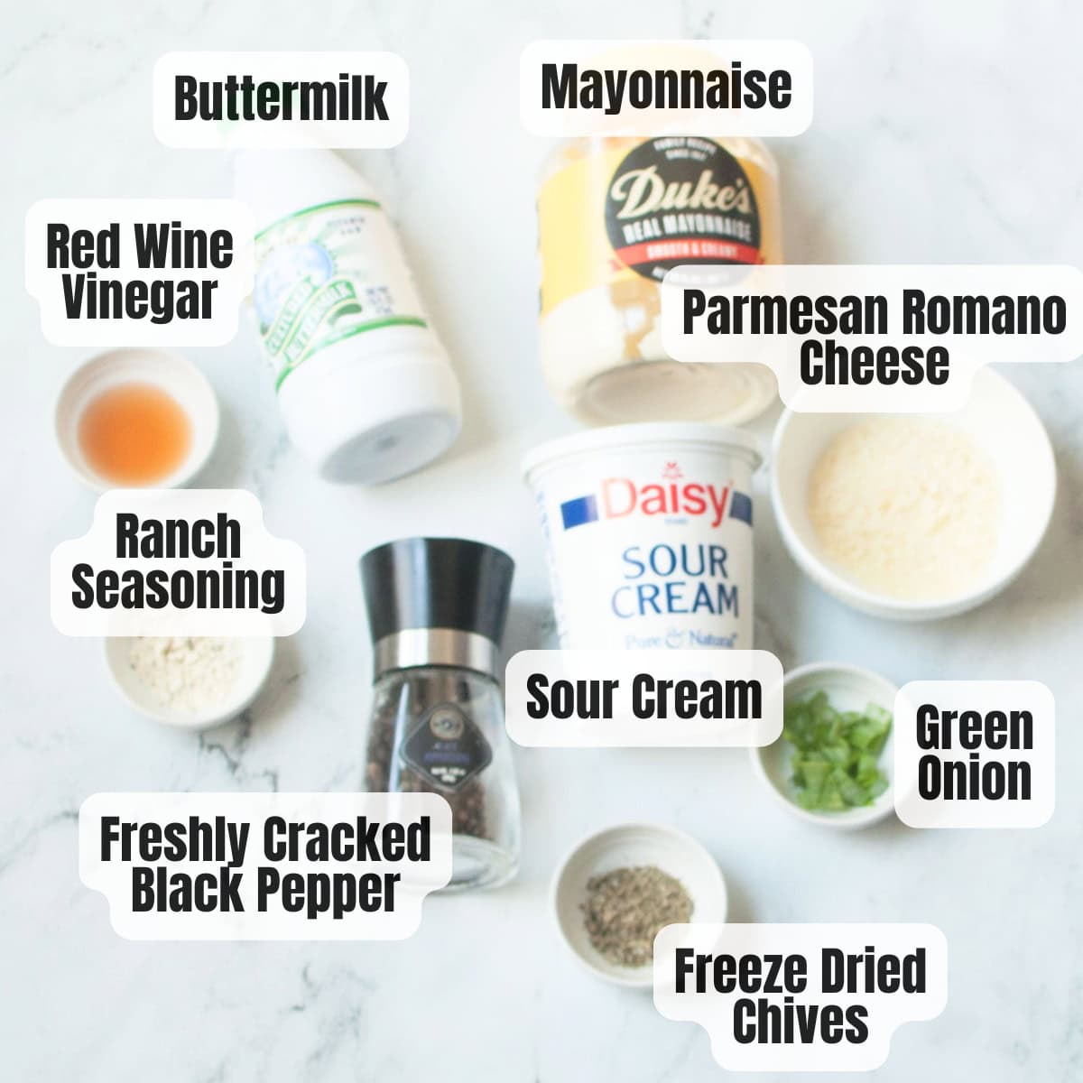 The ingredients needed to make Copycat Brios Creamy Parmesan salad dressing.
