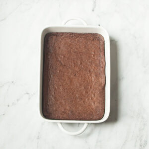 Amish brownies in a 9 x 13 inch pan on a marble background.