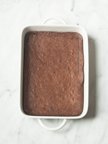 Amish brownies in a 9 x 13 inch pan on a marble background.