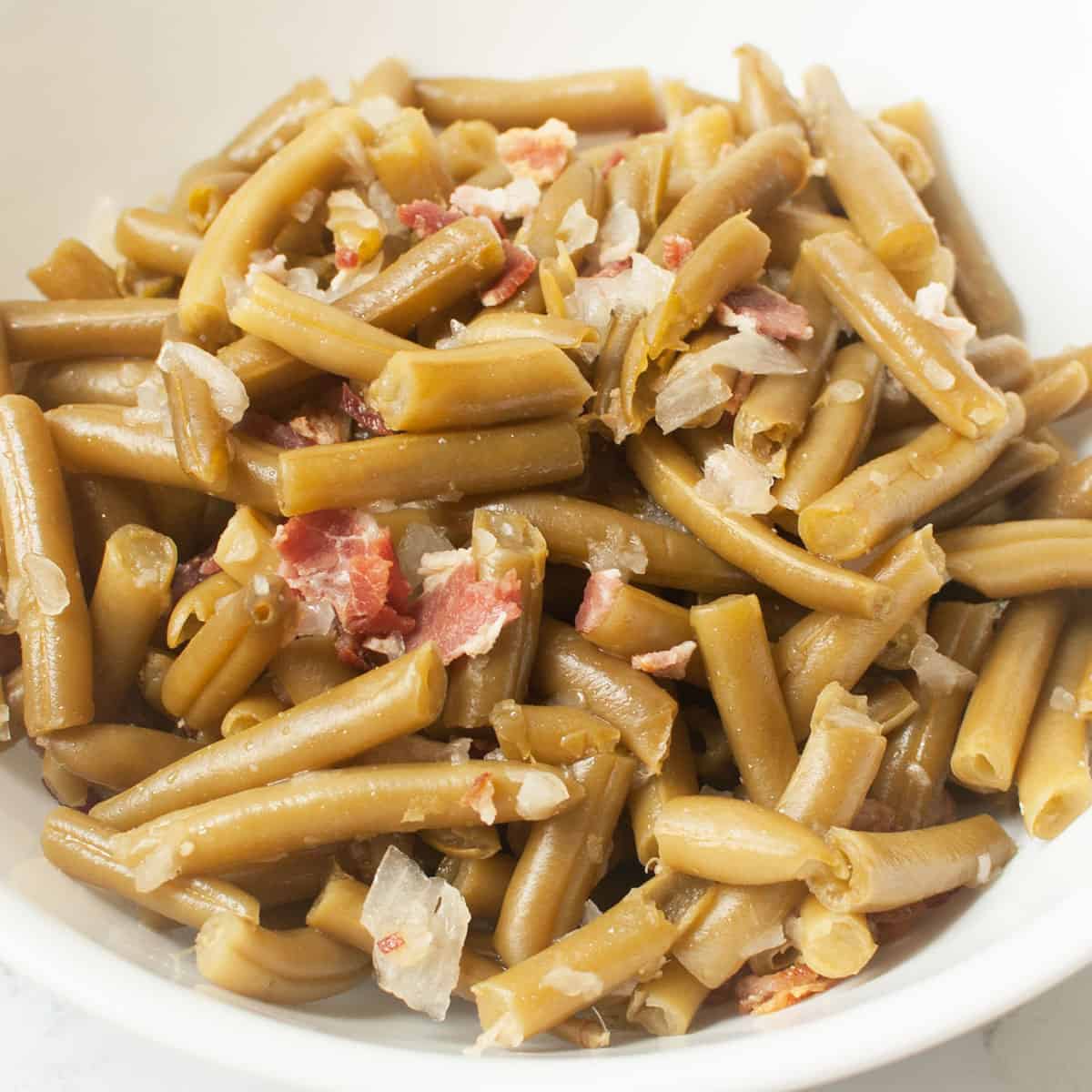 Copycat Texas Roadhouse Green Beans in a white bowl.