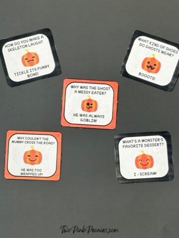A photograph of Halloween lunch box notes on a black background.