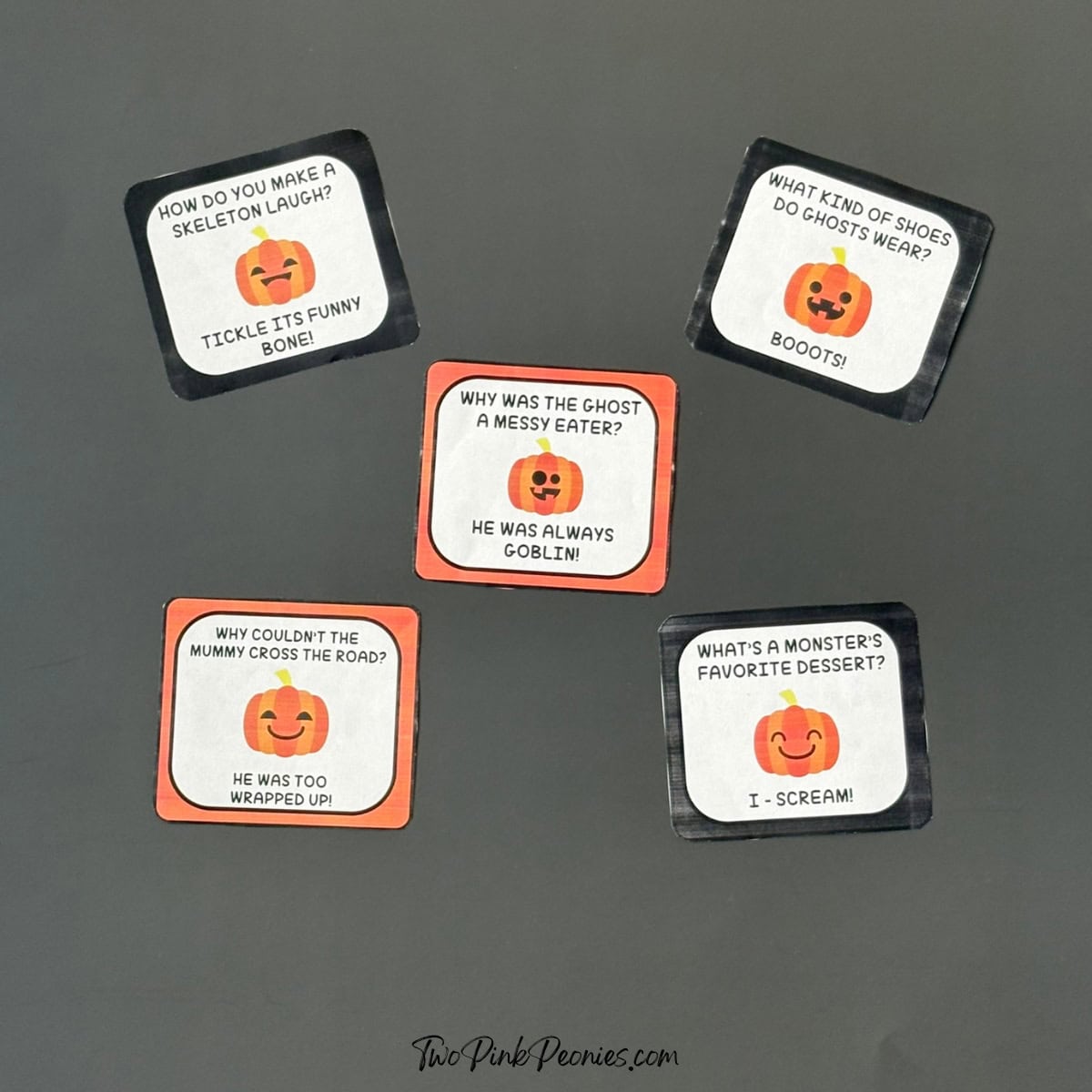 A photograph of Halloween lunch box notes on a black background.